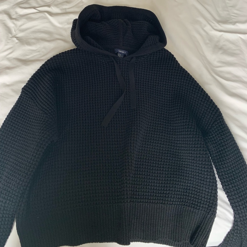 a cropped knitted sweater